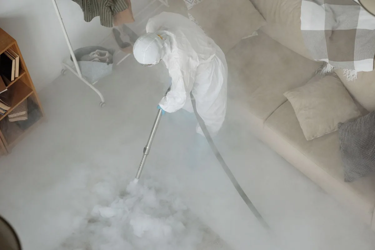 Biohazard cleanup technician in protective equipment, Many, LA